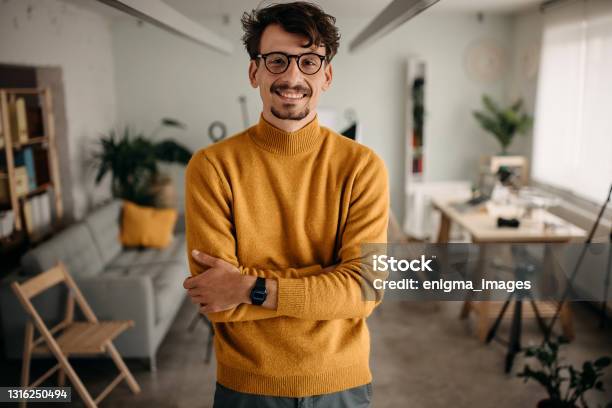 Photographer Is Finishing Work In His Office Stock Photo - Download Image Now - Creative Director, Photographer, Editing Equipment