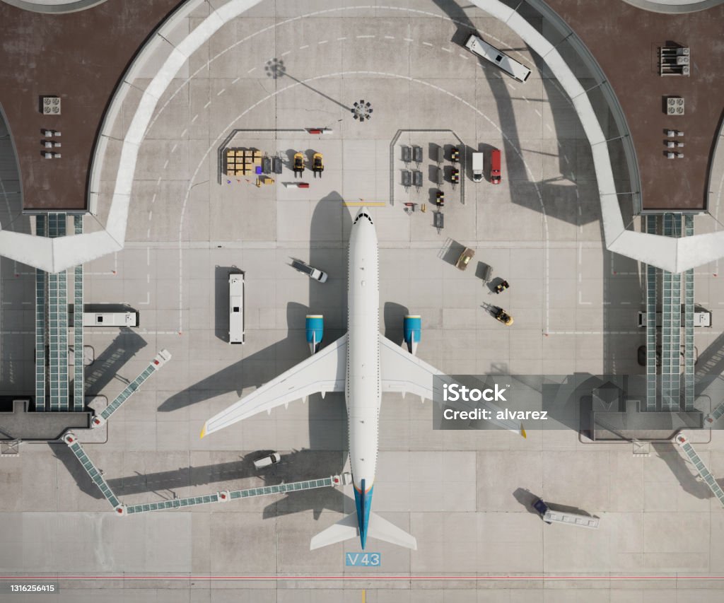 Top view of airplane at airport terminal in 3D Top view of airplane at airport terminal. 3D drone view of generic airport terminal with parked aircraft. Airplane Stock Photo