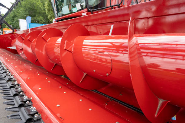 istock Red combine header reaper for harvesting in field 1316257697