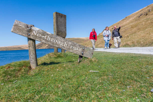 istock Three friends walking on no outlet road 1316258306