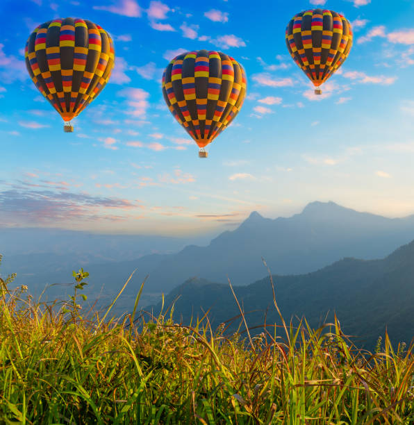 istock Mountain scenery with hot air balloons and beautiful sky 1316258805