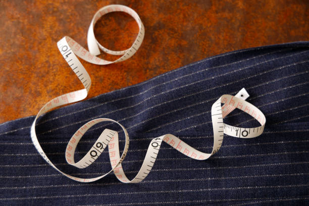 istock Men's clothing fabric and tape measure tailor image 1316259070
