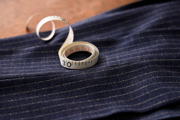 istock Men's clothing fabric and tape measure tailor image 1316259114