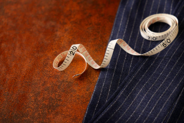 istock Men's clothing fabric and tape measure tailor image 1316259196