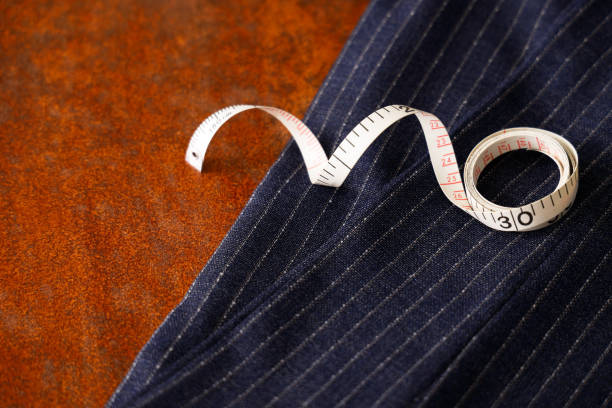 istock Men's clothing fabric and tape measure tailor image 1316259220