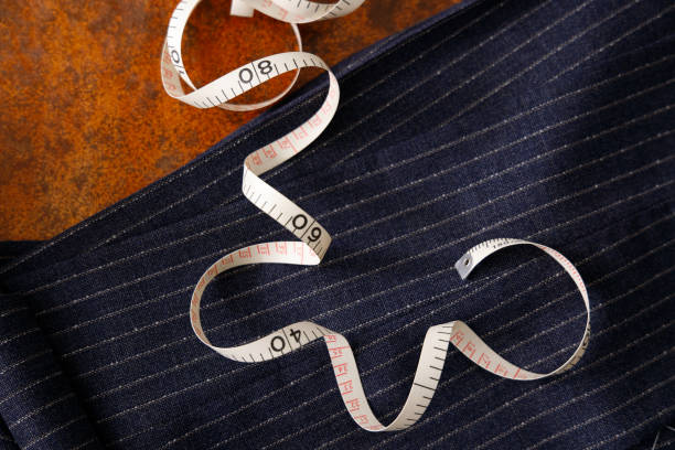 istock Men's clothing fabric and tape measure tailor image 1316259377