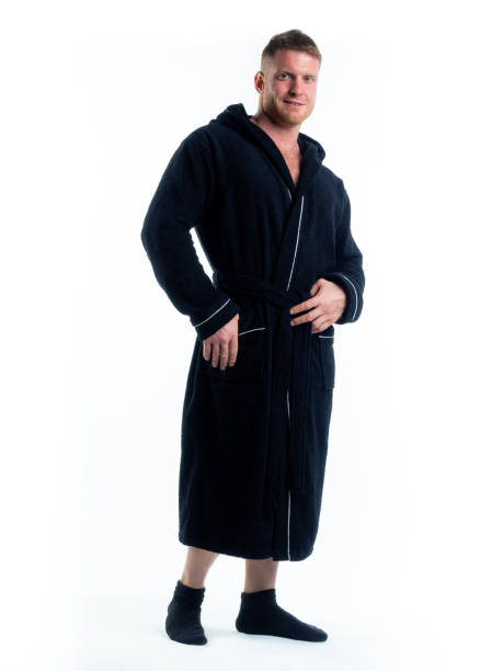istock strong man in a Bathrobe on an isolated white background with a smile on his face. 1316260984