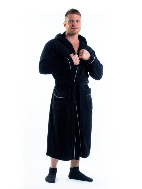 istock strong man in a Bathrobe on an isolated white background with a smile on his face. 1316260989