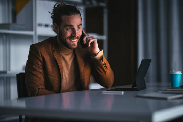 istock Cheerful businessman talking on smartphone in office 1316264203