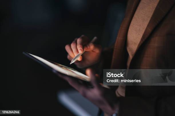 Crop Man With Stylus Using Tablet For Work At Night Stock Photo - Download Image Now