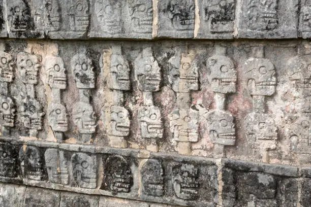 Skull reliefs at Tzompantli, the platform of skulls, Chichen-Itza, Yucatan peninsula, Mexico