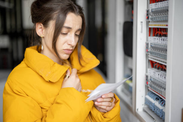 istock Woman checking bills for electricity at home 1316265752