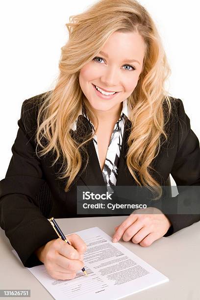 Young Businesswoman Signing A Document Stock Photo - Download Image Now - Adult, Adults Only, Agreement