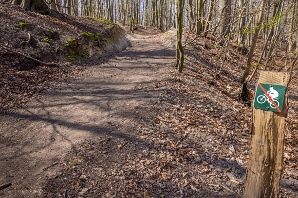 Dirt track and a sign prohibiting mountain bikers. This is typical for the conflicts between the users of the nature round Copenhagen