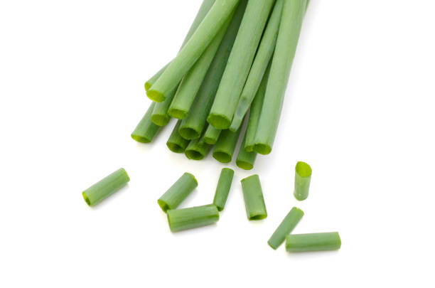istock Green onion bunch with chopped, isolated on white 1316271410