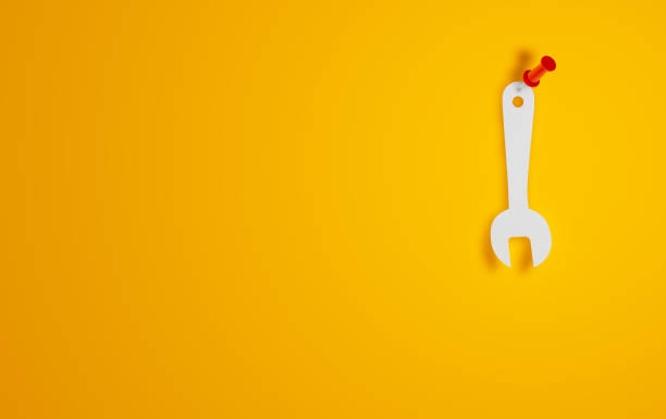 wrench symbol on yellow background - screwdriver screw tighten fastener imagens e fotografias de stock