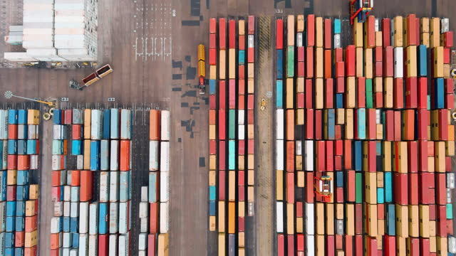 Straight down aerial view of thousands of shipping containers waiting on the docks to be loaded onto a container ship at Durban harbour, South Africa