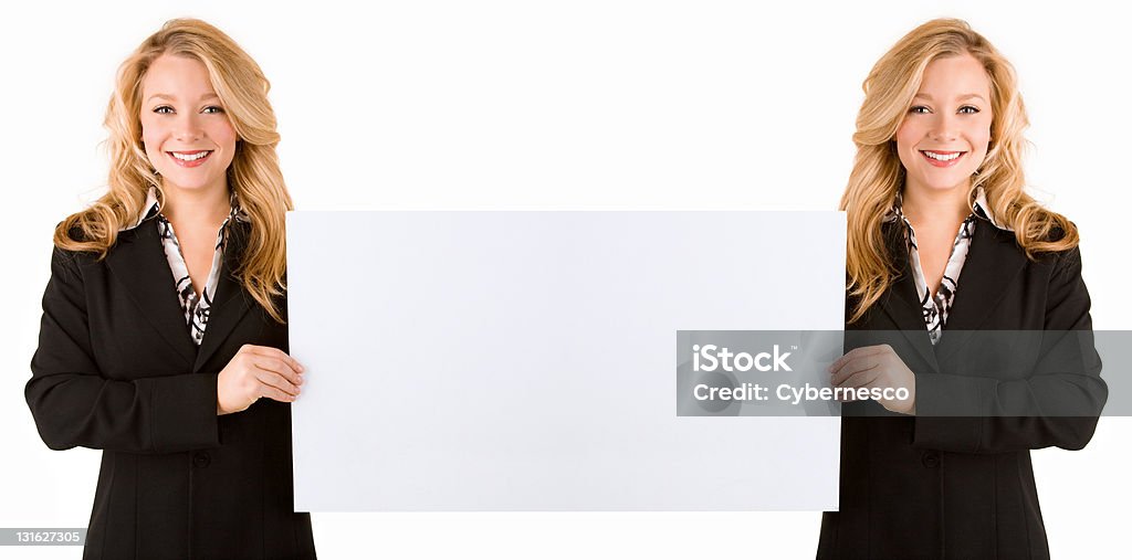 Mirrored Effect of Woman Holding a Large Blank Card This is a mirrored effect of woman holding a large blank card. Adult Stock Photo