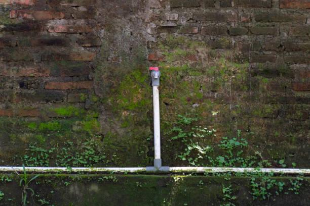 istock a red tap is on the brick wall 1316273817
