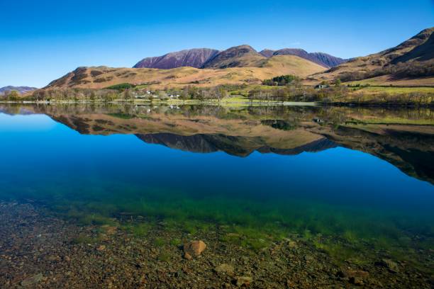 istock Reflections of Robinson (mountain) in gin clear Buttermere. 1316274345