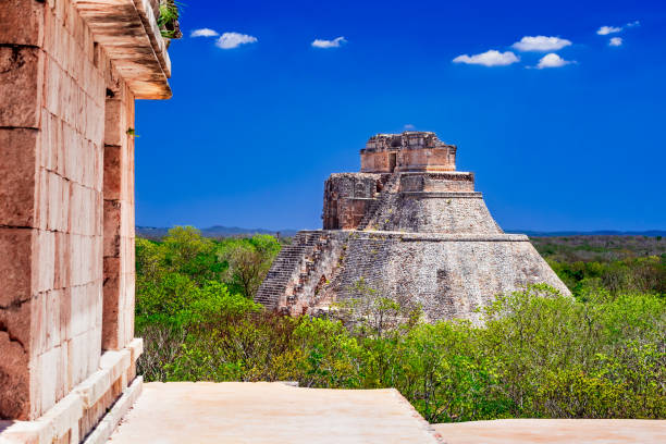 Uxmal, Mexico. Pyramid of the Magician in ancient jungle Mayan city Uxmal, Yucatan Peninsula.