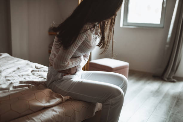 istock Female Experiencing Morning Stomach Cramps 1316277524