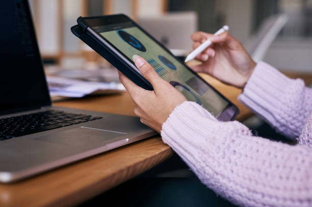 istock Shot of an anonymous person using a digital tablet to work in an office 1316278402
