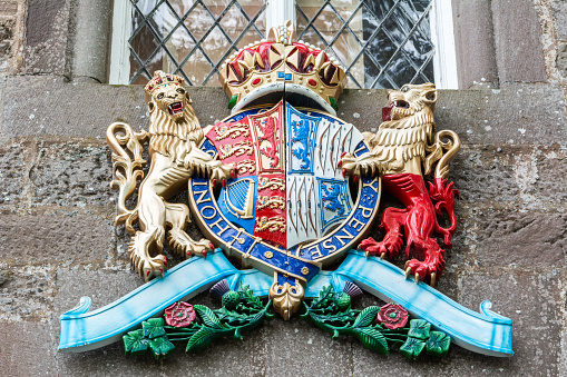 Glamis, Scotland, United Kingdom - September 11, 2017. The coat of arms of the late Queen Elizabeth the Queen Mother, at the entrance of Glamis Castle in Scotland.