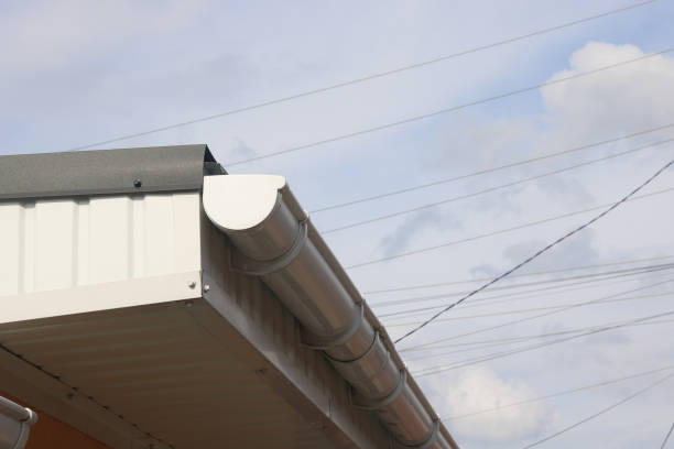 istock Part of roof with plastic gutter against blue sky 1316278809