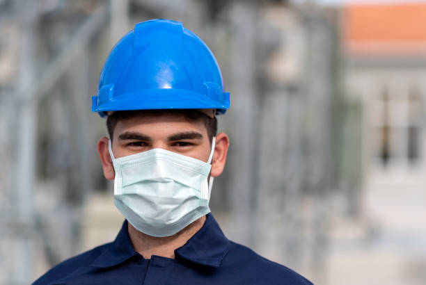 istock Technician man wearing protection face mask against coronavirus (COVID-19) and looking at camera 1316278955