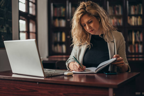 istock Businesswoman working in her office and using a laptop 1316280814
