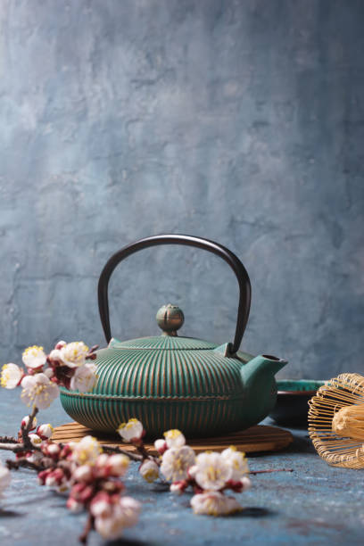 istock Tea ceremony. Traditional asian cast iron kettle, bamboo whisk or chasen 1316281913