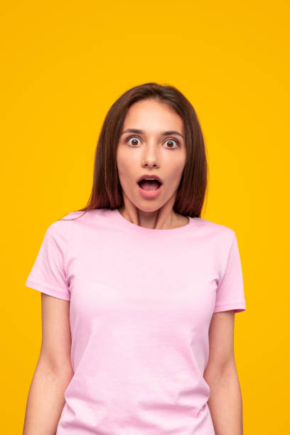 istock Shocked woman with mouth opened looking at camera 1316282257