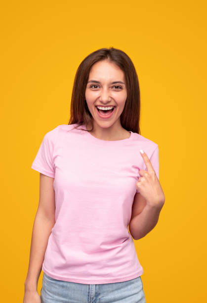 istock Excited young woman pointing at smile 1316282272