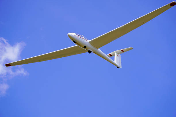istock White glider with blue cloudless sky in the background. Aircraft for gliding. 1316283589