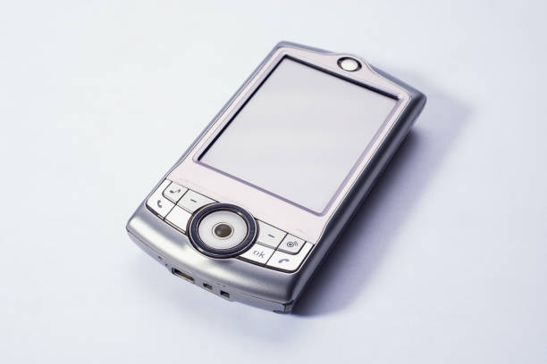 The old mobile phone is out of date. Touch screen. Light background.