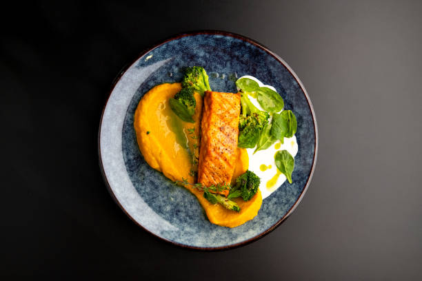 istock Grilled red fish fillets. Salmon with vegetable puree and spinach. 1316286443