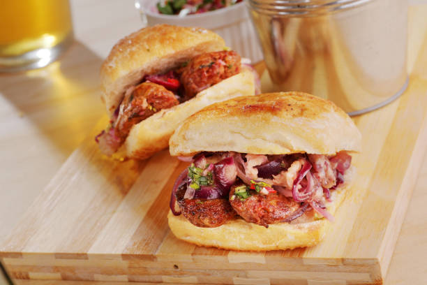 A close up of a pair of chorizo based hot dogs commonly known as \