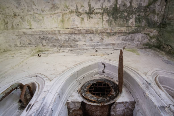 istock Old brick abandoned semicircular drainage tunnel that goes outside 1316288117