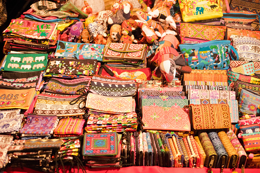 Colorful art products and wallets on night market in Vientiane