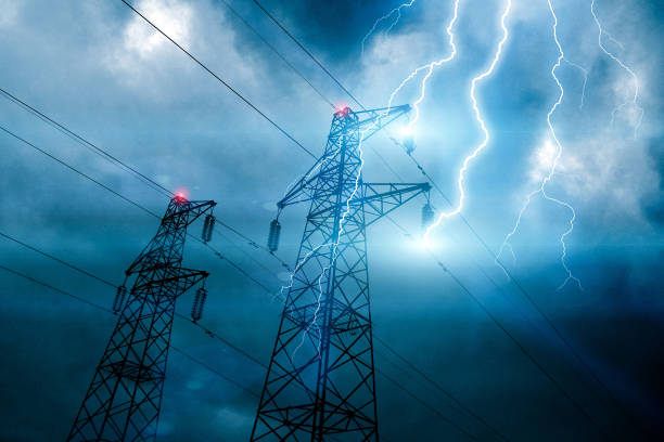 Storm lightning hitting powerline tower Storm lightning hitting powerline tower with bolts and plasma balls forming along electricity cables. Possible blackout. Cloudy sky with stormy weather at dusk. Digital composite. plasma ball photos stock pictures, royalty-free photos & images