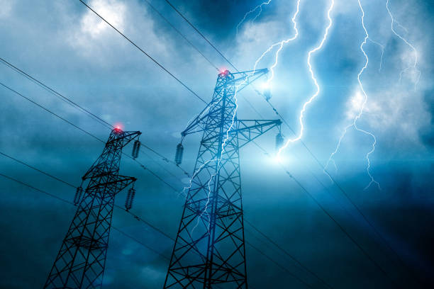 Storm lightning hitting powerline tower Storm lightning hitting powerline tower with bolts and plasma balls forming along electricity cables. Possible blackout. Cloudy sky with stormy weather at dusk. Digital composite. blackout stock pictures, royalty-free photos & images