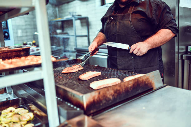 istock Cook In Kitchen Making Barbecue And Roasted Bread 1316296363