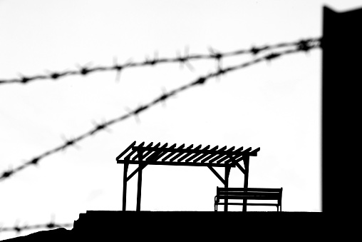 A resting place is protected by barb wire. It is in silhouette in Turkey.