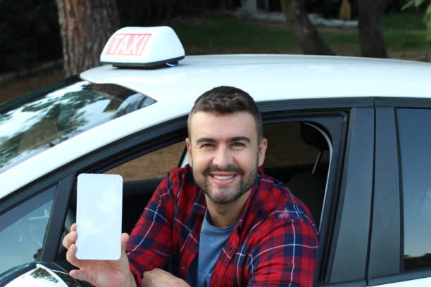istock Driver showing mobile phone screen with a smile 1316297376