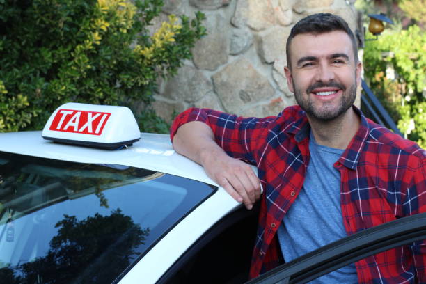 istock Young taxi driver at work 1316297453