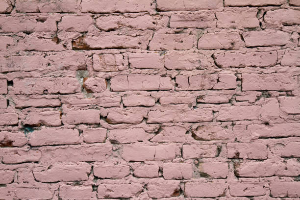 istock Brick wall covered in pink paint 1316298492
