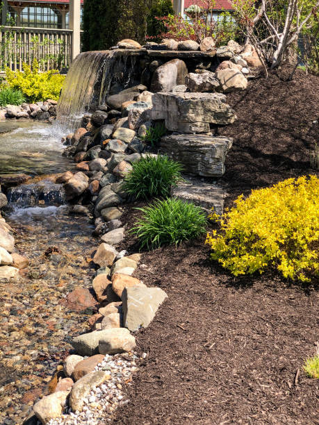 istock Side view of a small rocky waterfall 1316298608