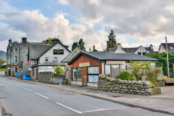Street view in Fort Augustus village in the Highlands of Scotland Fort Augustus, Scotland, United Kingdom – September 25, 2017. Street view in Fort Augustus village in the Highlands of Scotland. View with buildings and commercial properties. fort augustus stock pictures, royalty-free photos & images