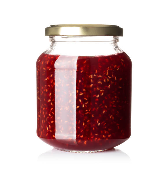 istock Glass jar with raspberry jam isolated on the white background 1316300243